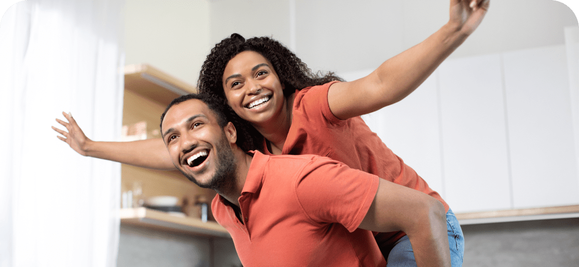 A joyful couple having fun at home.
